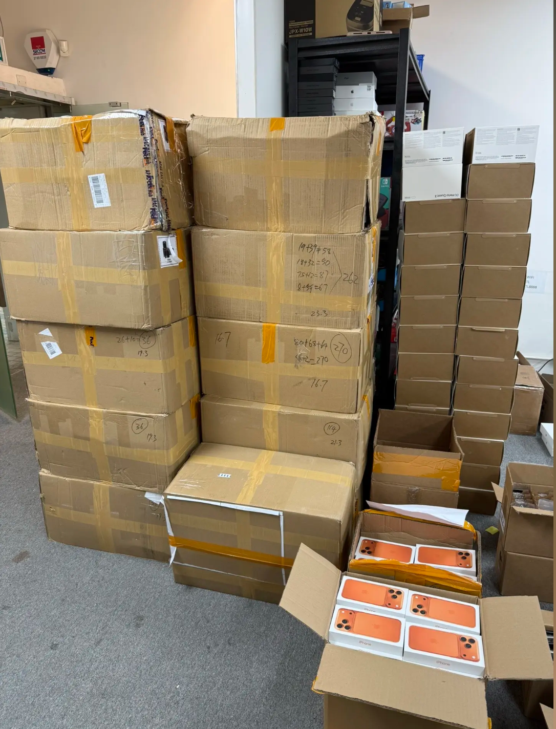 B2B buyer reviewing Activation Lock questions with iPhone setup screens, ownership-transfer records, IMEI data, and wholesale quality-control documents.