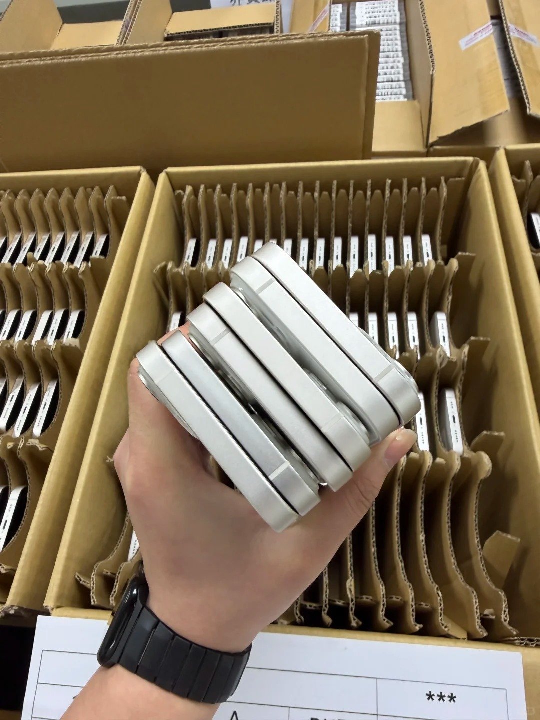 HQB quality-control team confirming used iPhone ownership status through lawful setup verification, IMEI records, and transparent batch documentation before wholesale approval.