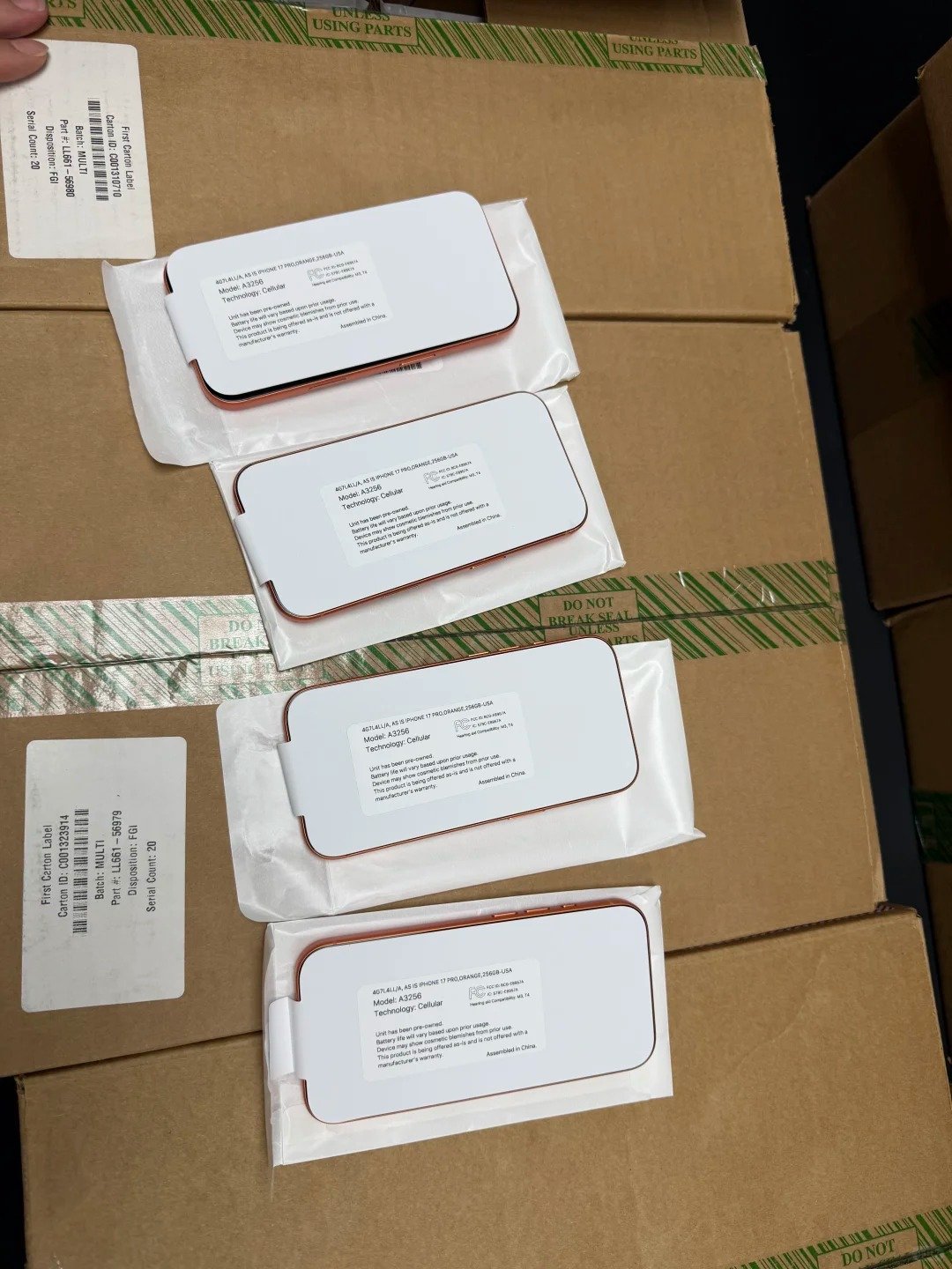 Buyer beginning setup on a freshly erased used iPhone to verify that no iPhone Locked to Owner screen or previous owner account request appears.