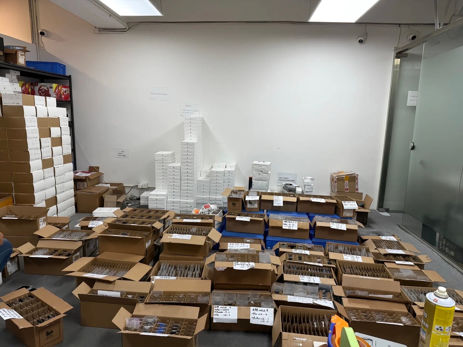 Bulk used iPhone order packed in labelled trays