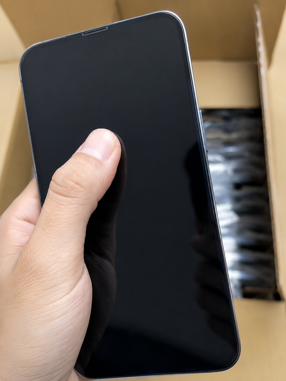 HQB quality-control team approving factory-unlocked used iPhones after verifying No SIM restrictions, IMEI records, regional compatibility, battery condition, and device functionality.