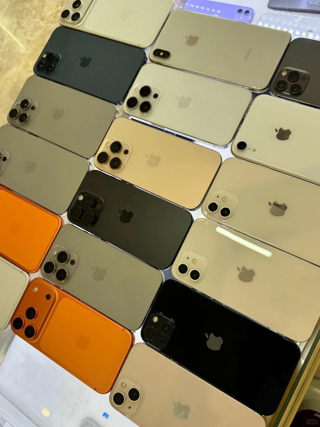 HQB collection of iPhone connectivity and verification guides beside inspected inventory