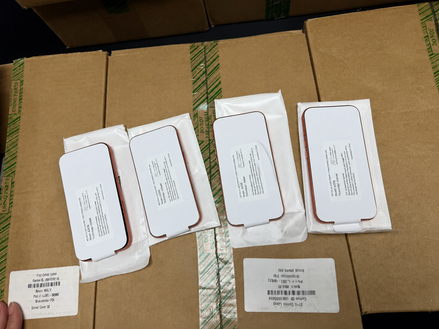 Used iPhones packaged horizontally for wholesale order preparation