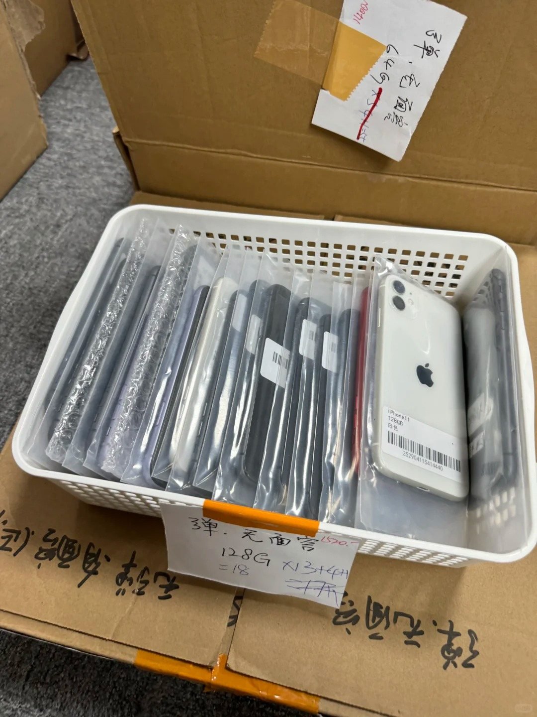 Used iPhone stock organised in protective sleeves for confirmation